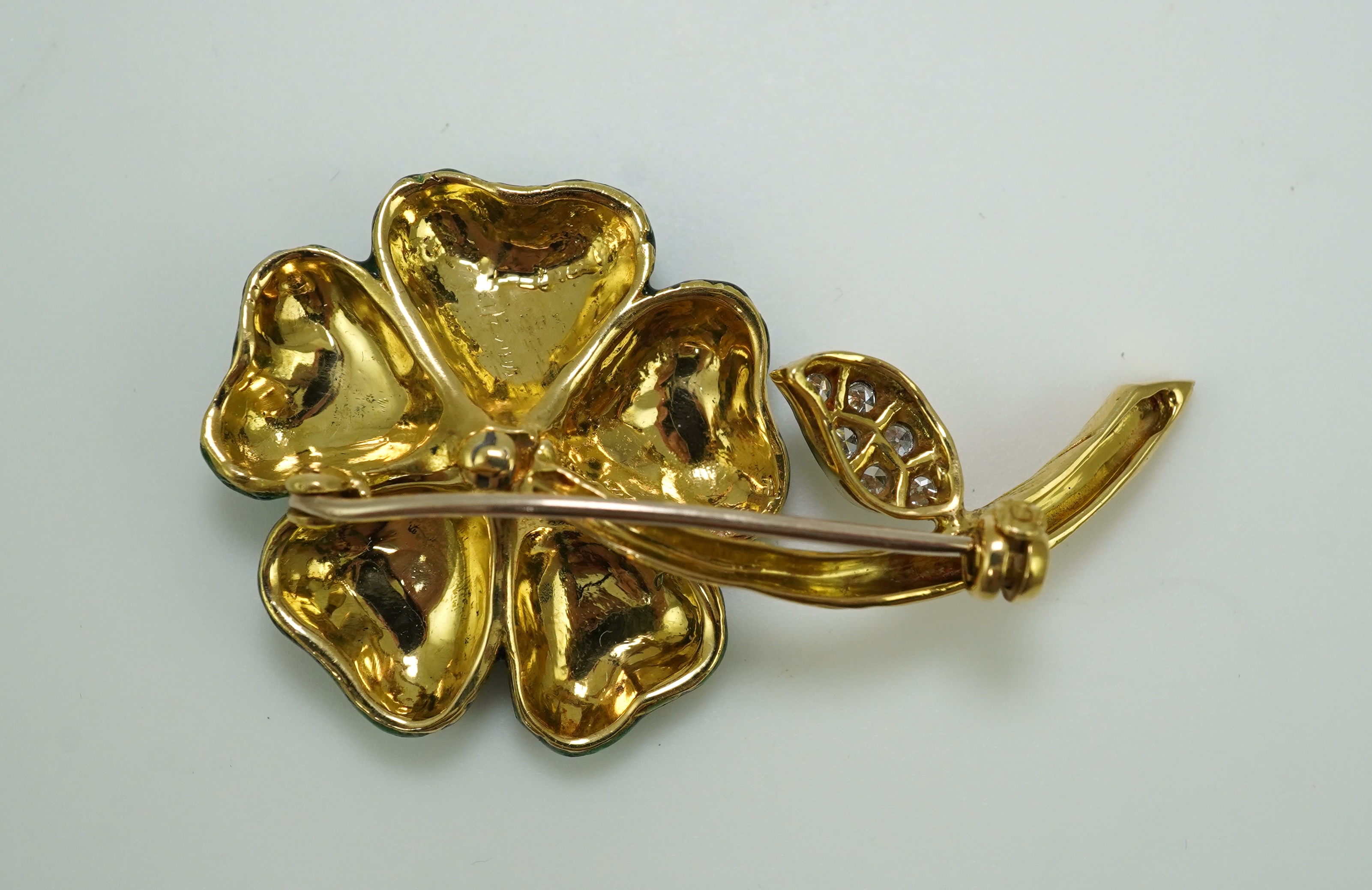 An enamel and diamond brooch